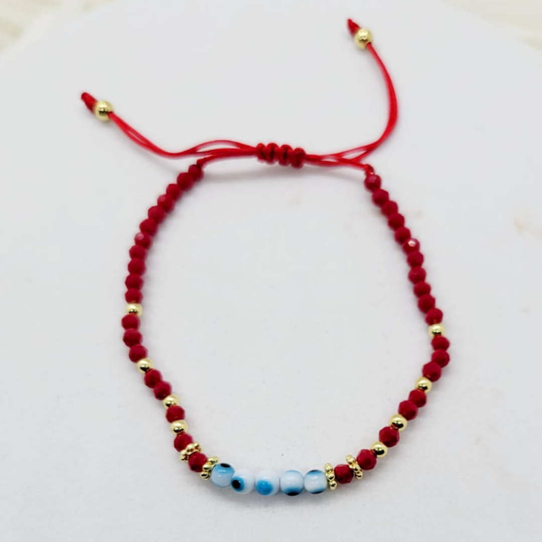 Pulsera Ajustable Ojitos con Hilo Rojo